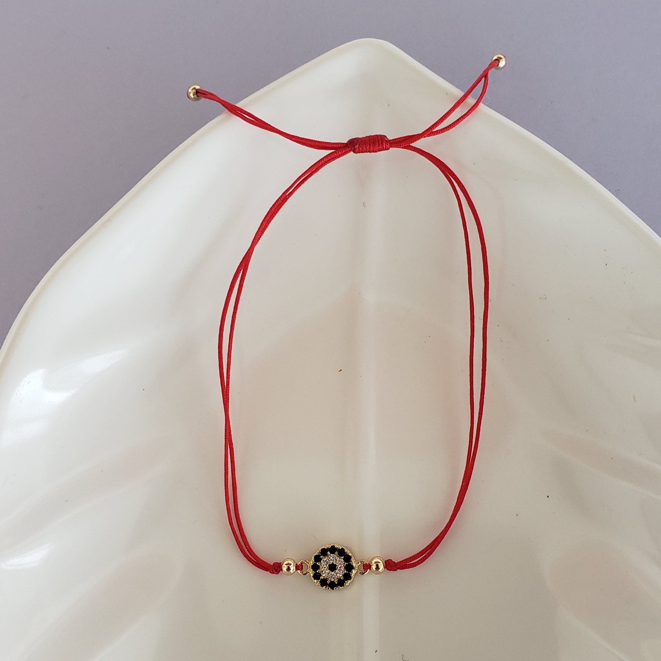 Pulsera Hilo rojo ojo en dorados